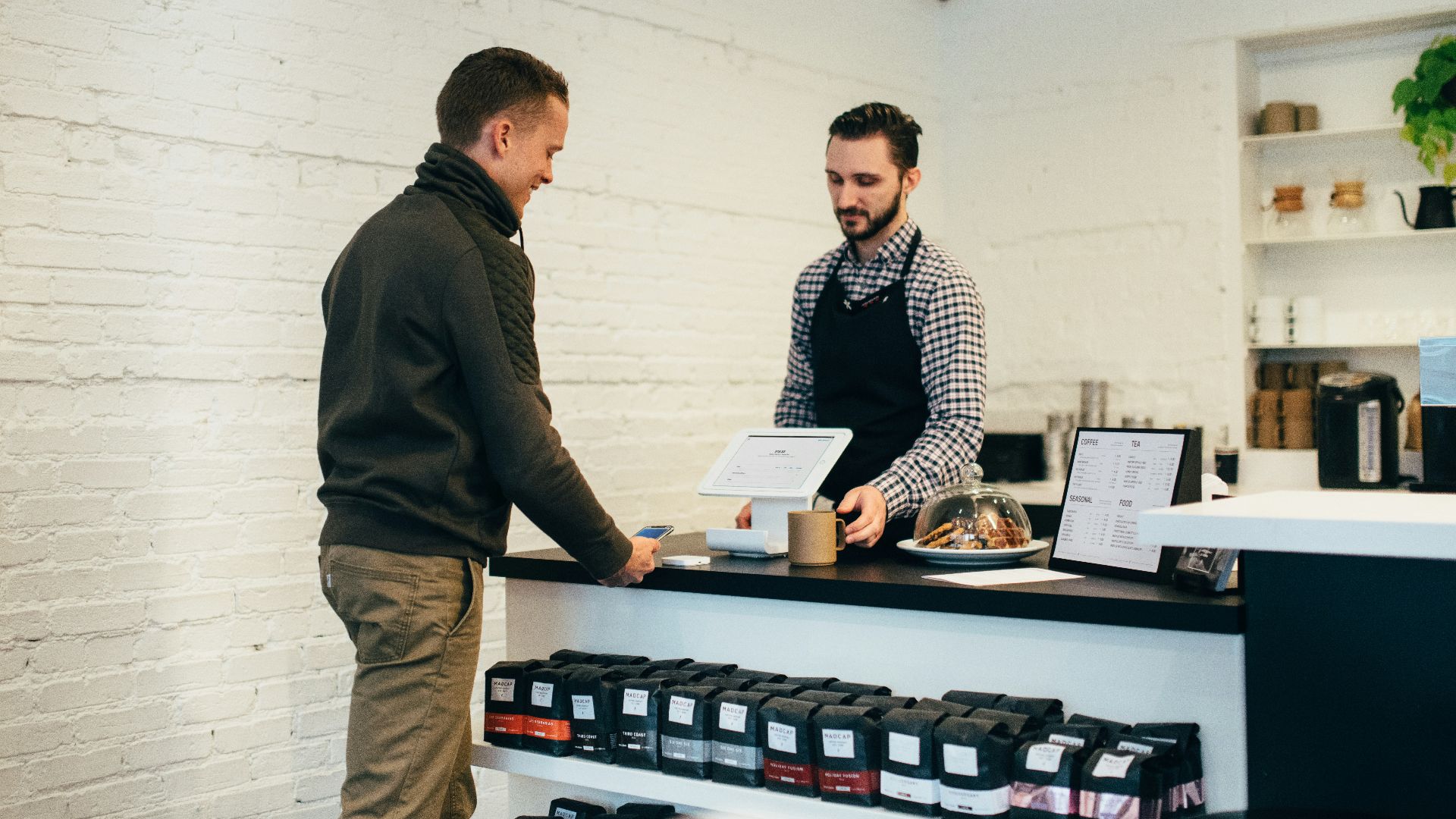 man buying item in shop