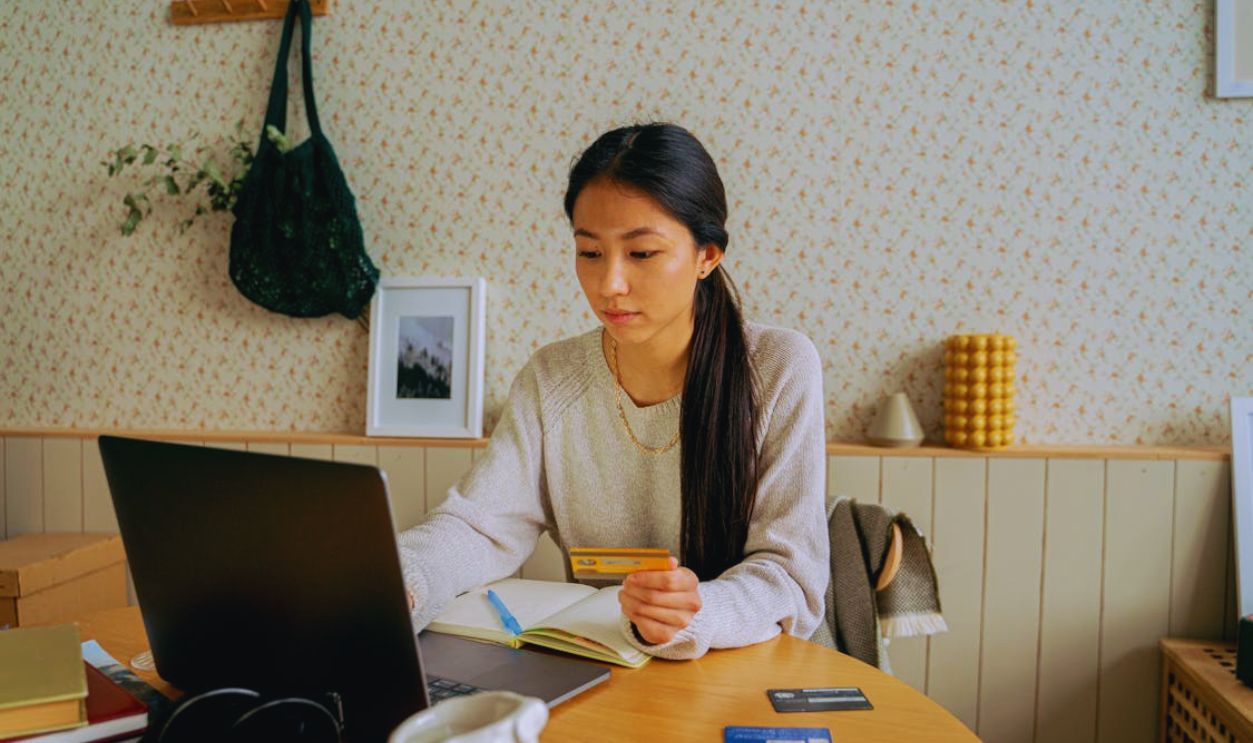 Woman in Gray Sweater Online Shopping