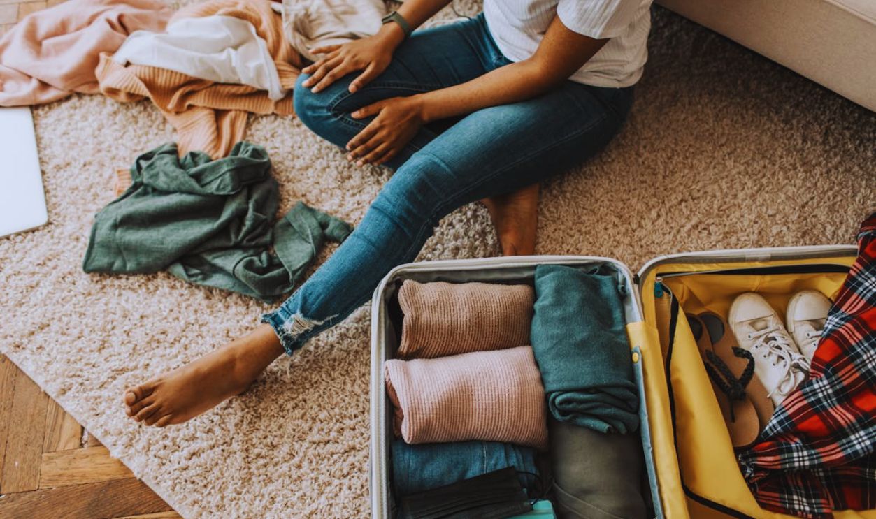 A Woman Packing Her Suitcase