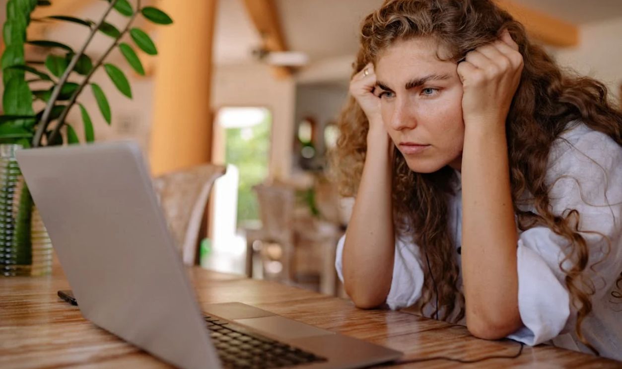 A Woman Looking a Laptop