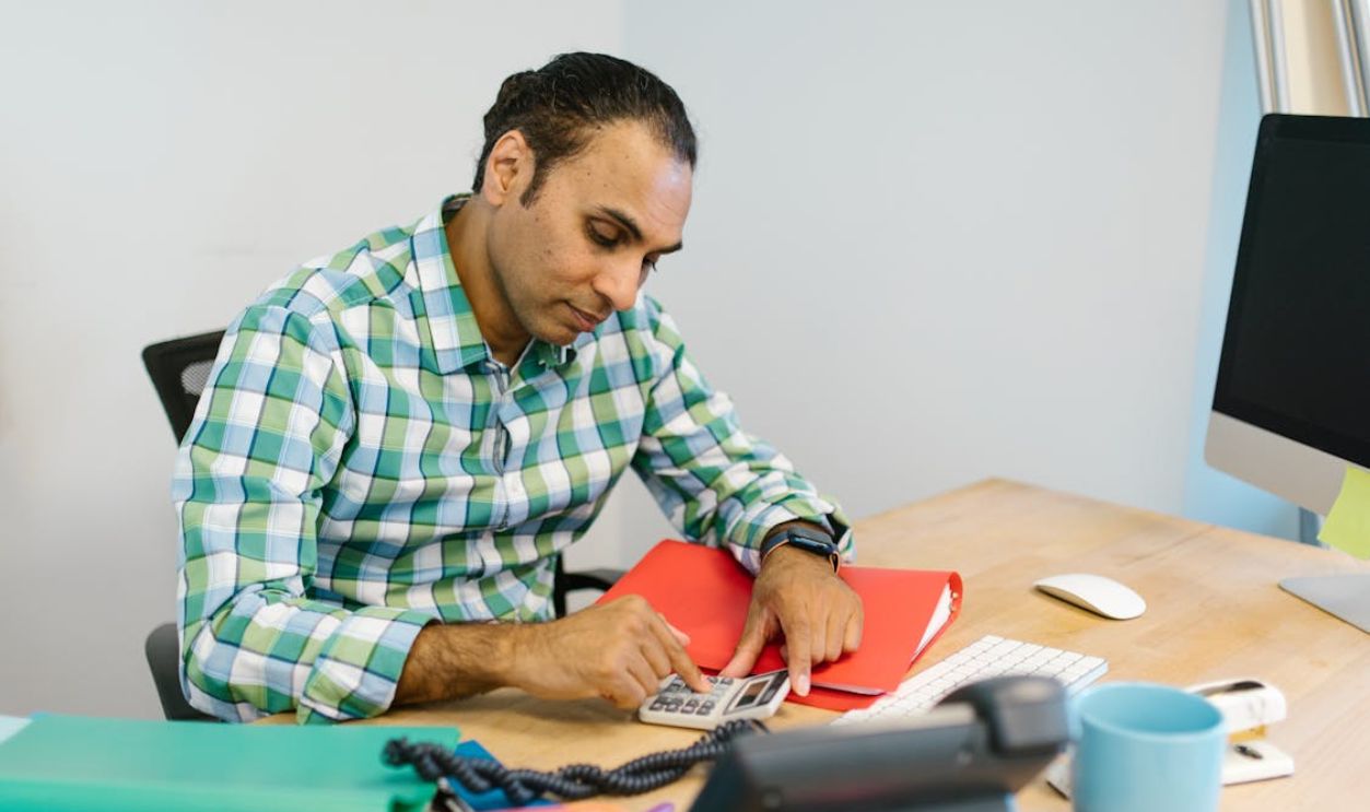 Man Using a Calculator