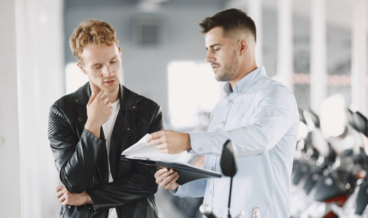Customer Talking to the Motor Vehicle Dealer