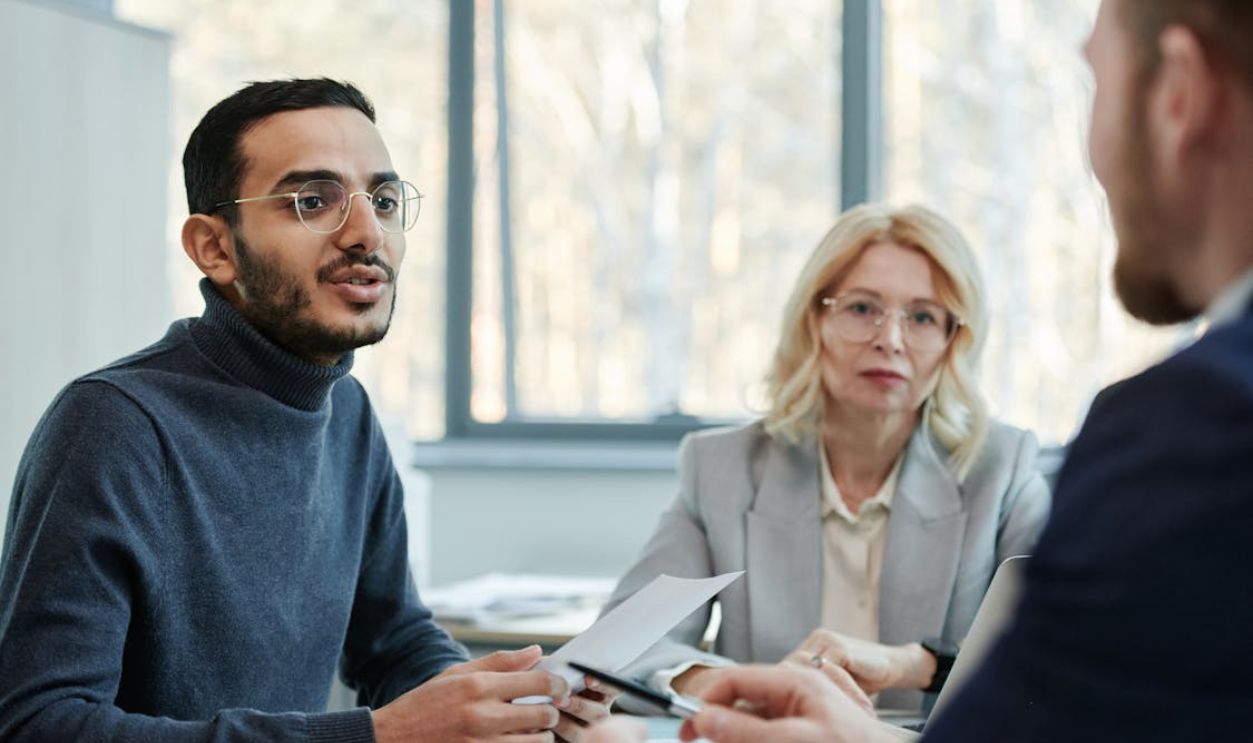 A Group of People Having a Meeting in the Office