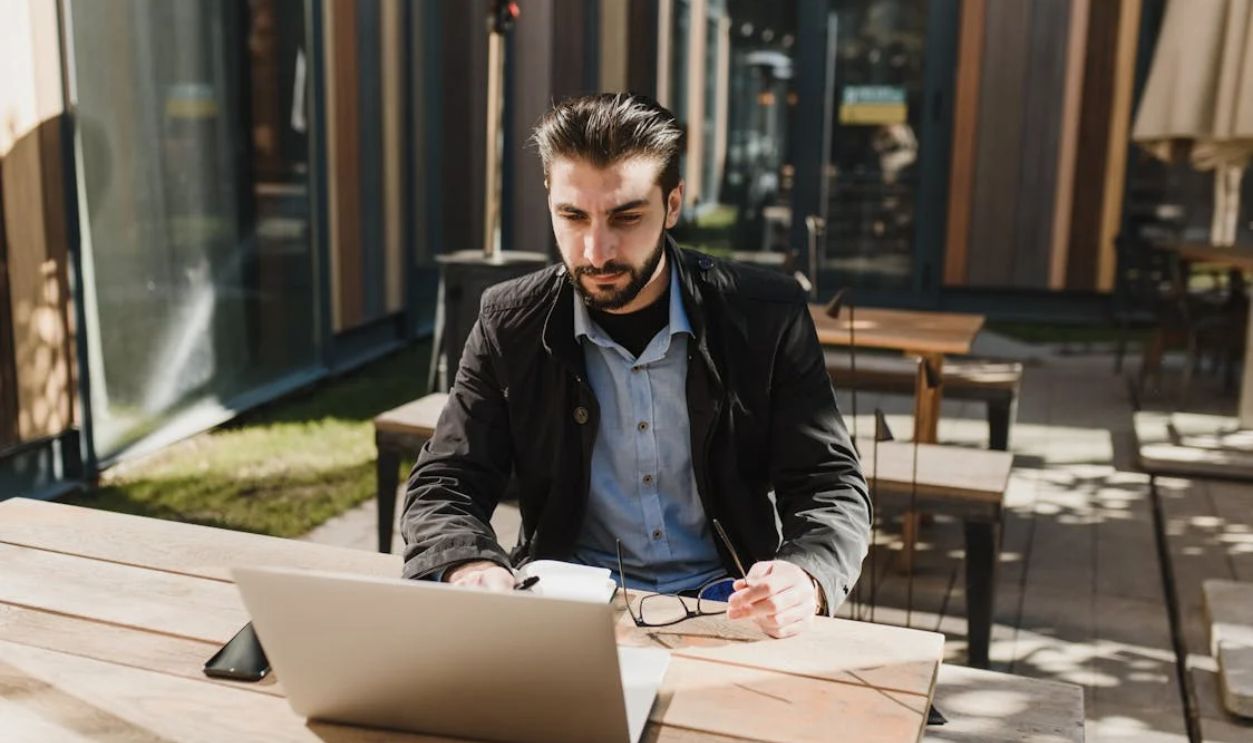 A Handsome Man Working on His Laptop