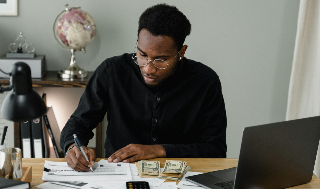 a-man-writing-on-the-paper