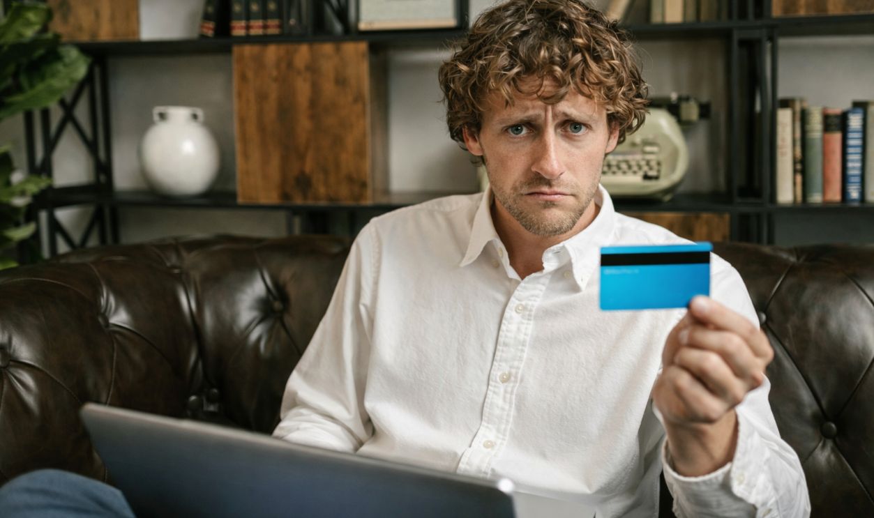Worried man with credit card
