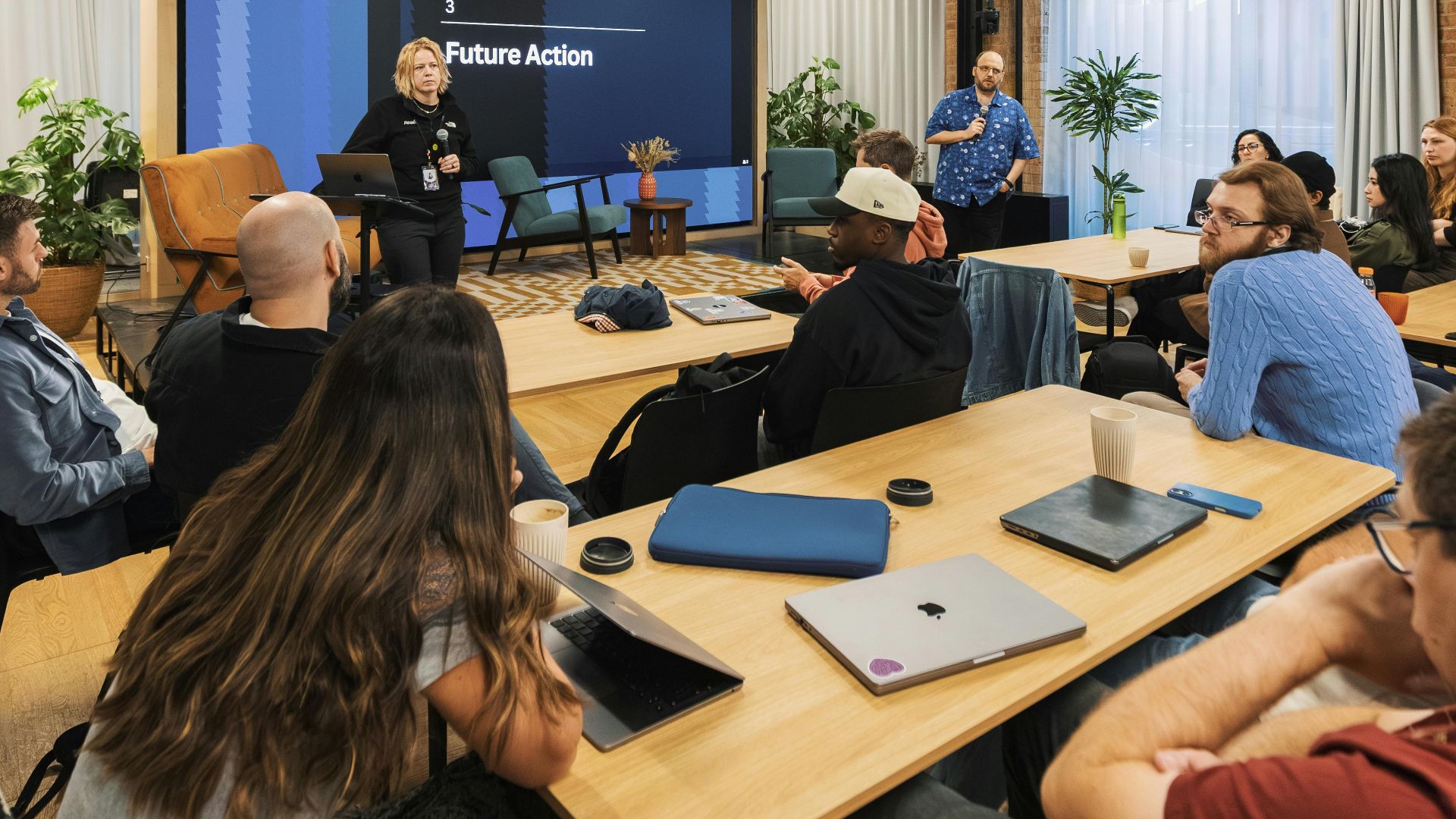 Dynamic workshop with diverse participants discussing future strategies in a modern space.