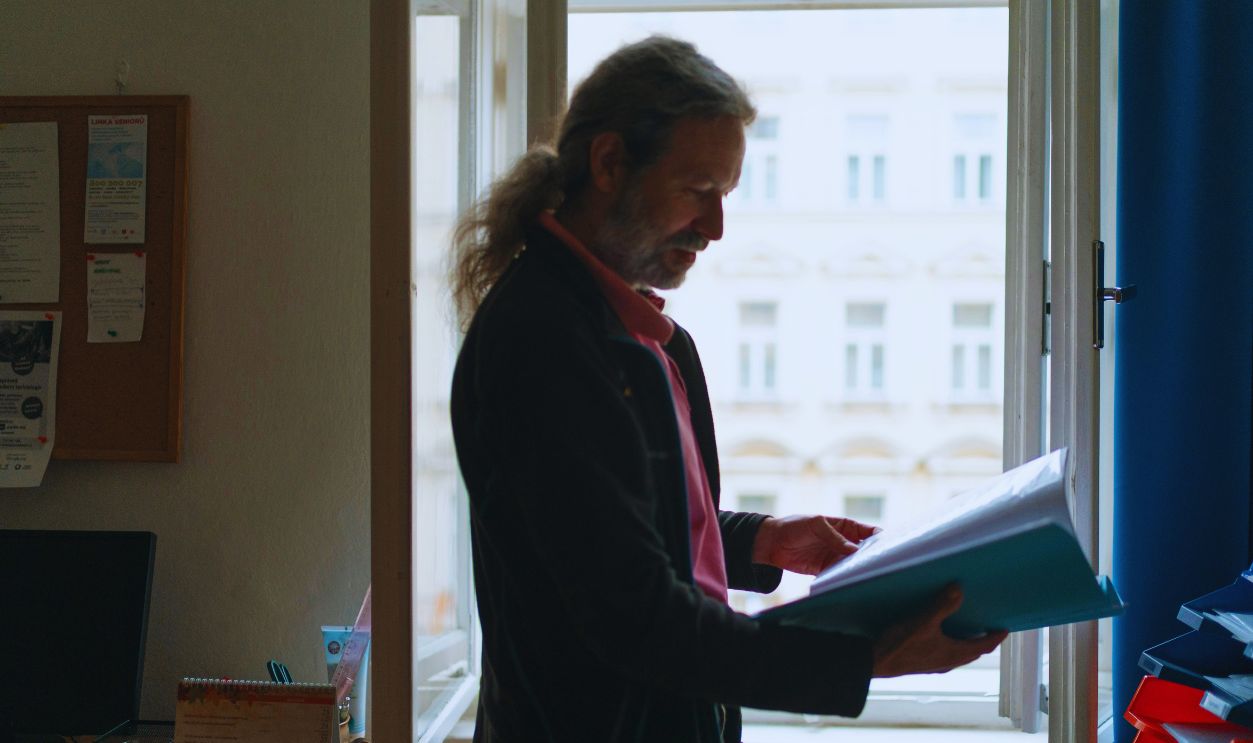 Elder man checking file