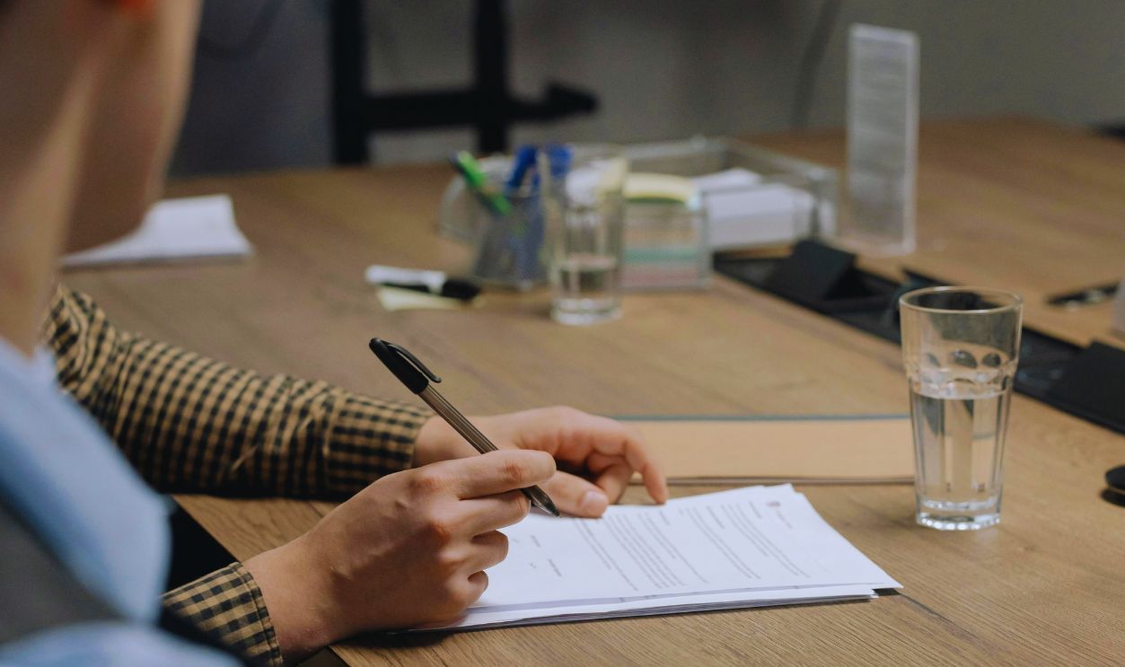 A Person Signing Contract Documents