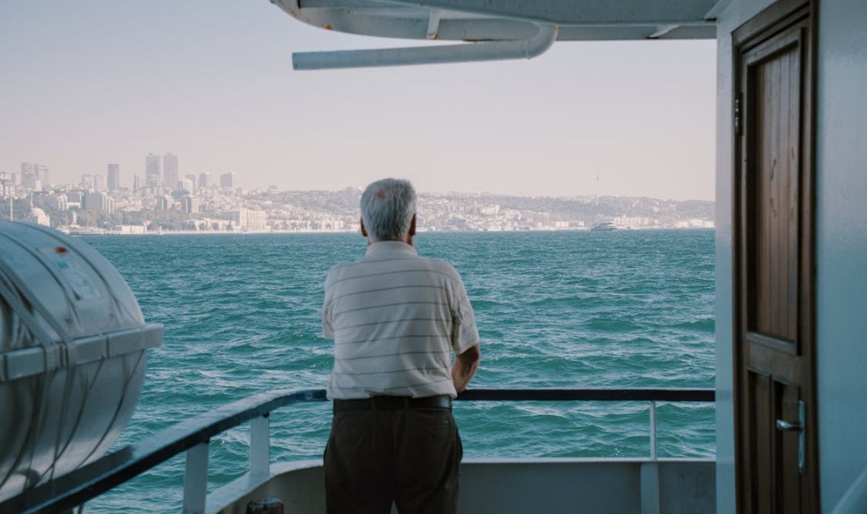 Elderly Man Contemplating Bosphorus from Ferry