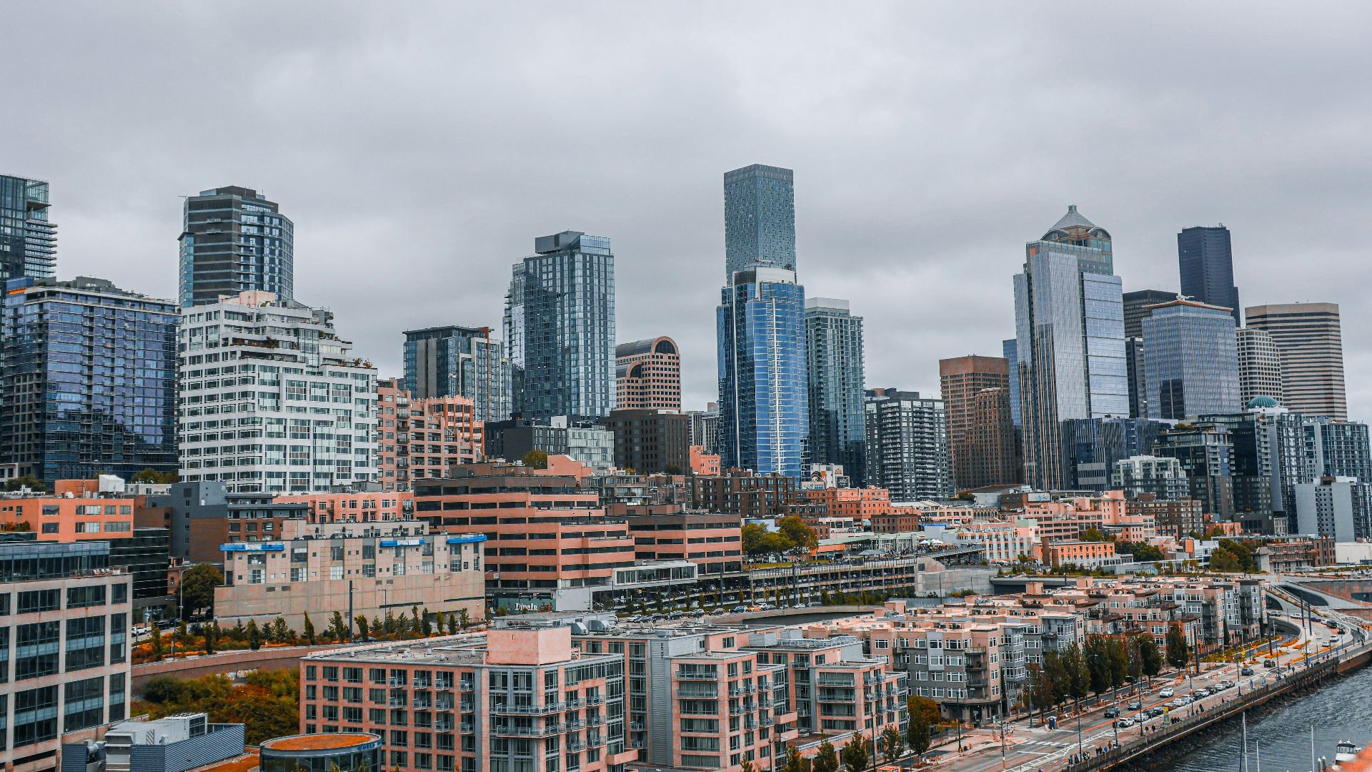 Seattle's modern skyline under a cloudy sky.