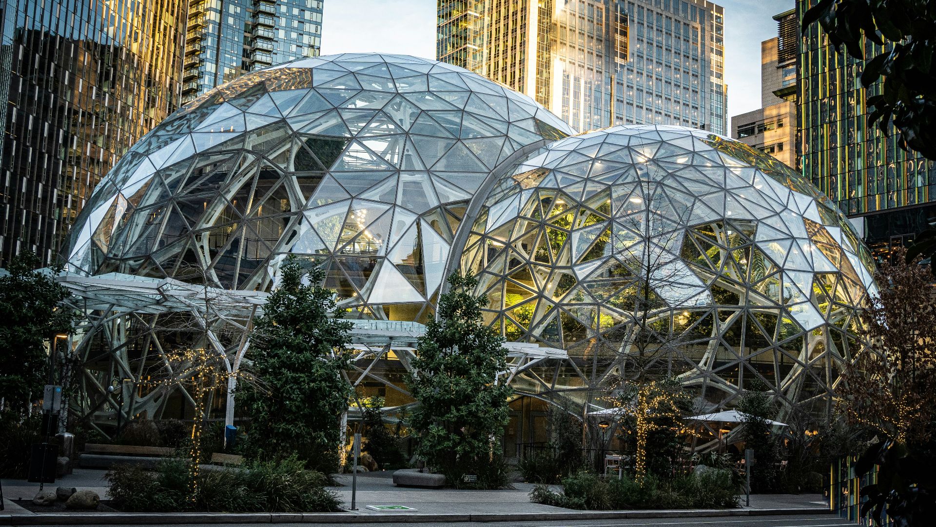 a couple of large glass domes sitting in the middle of a street