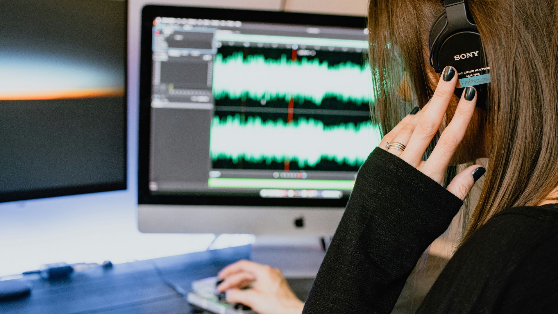 woman in black long sleeve shirt using black laptop computer