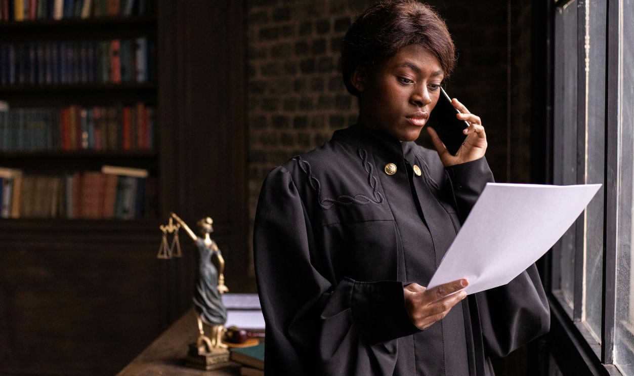 A Judge Reading a Document while Having a Phone Call