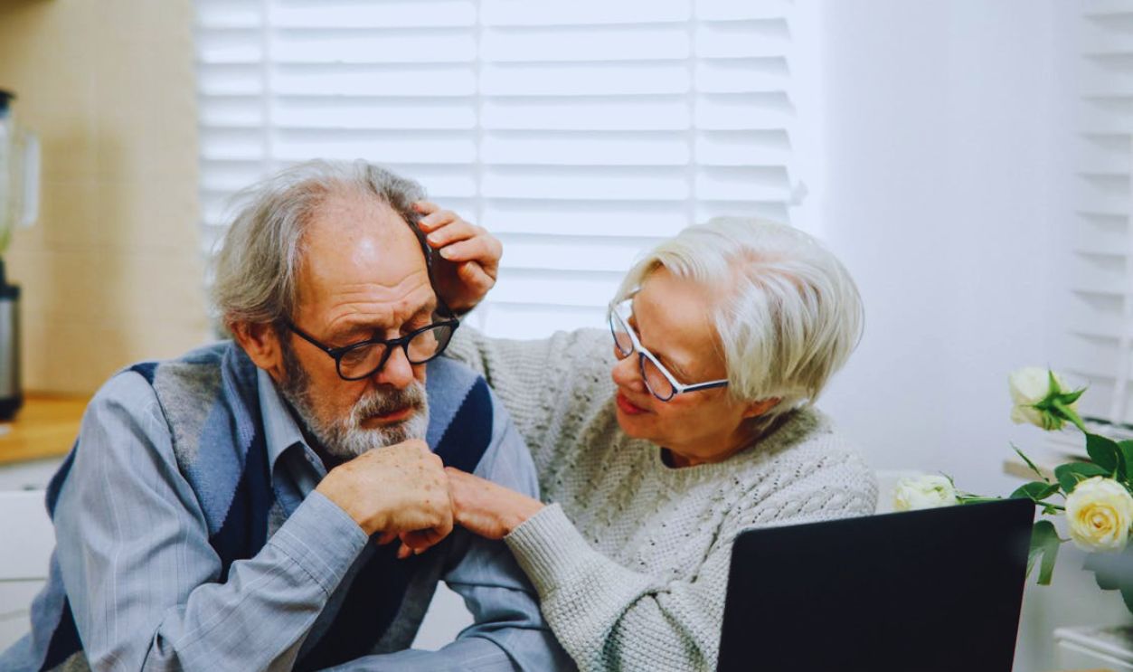 Old Couple Using Laptop at Home Together