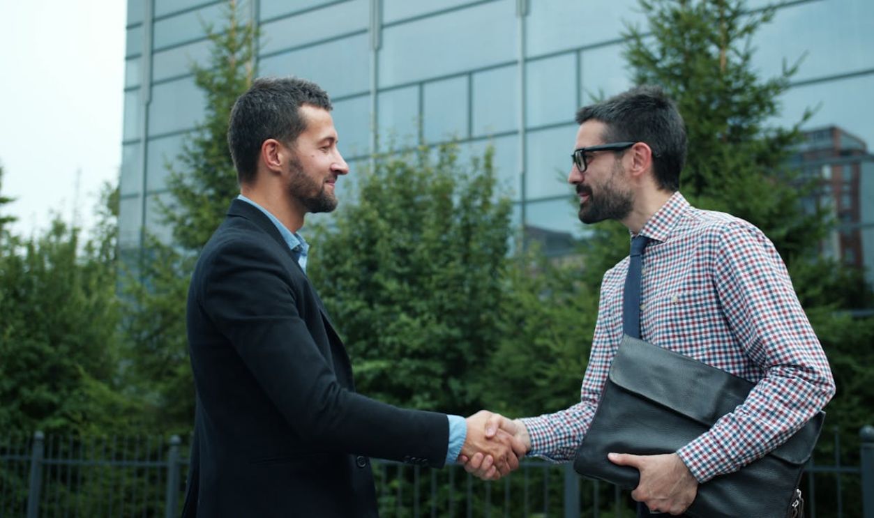 Businessmen Shaking Hands Outdoors