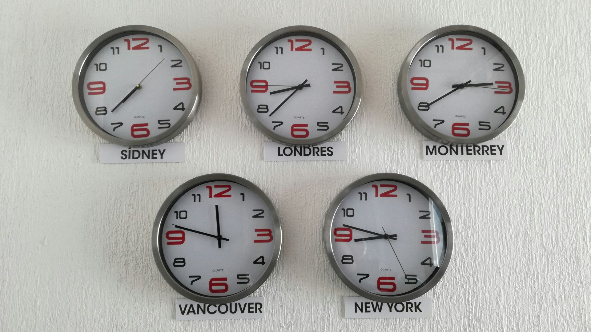 five assorted country wall clocks