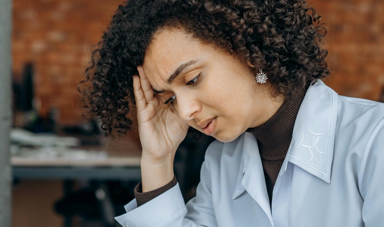 An Exhausted Woman Reading Files