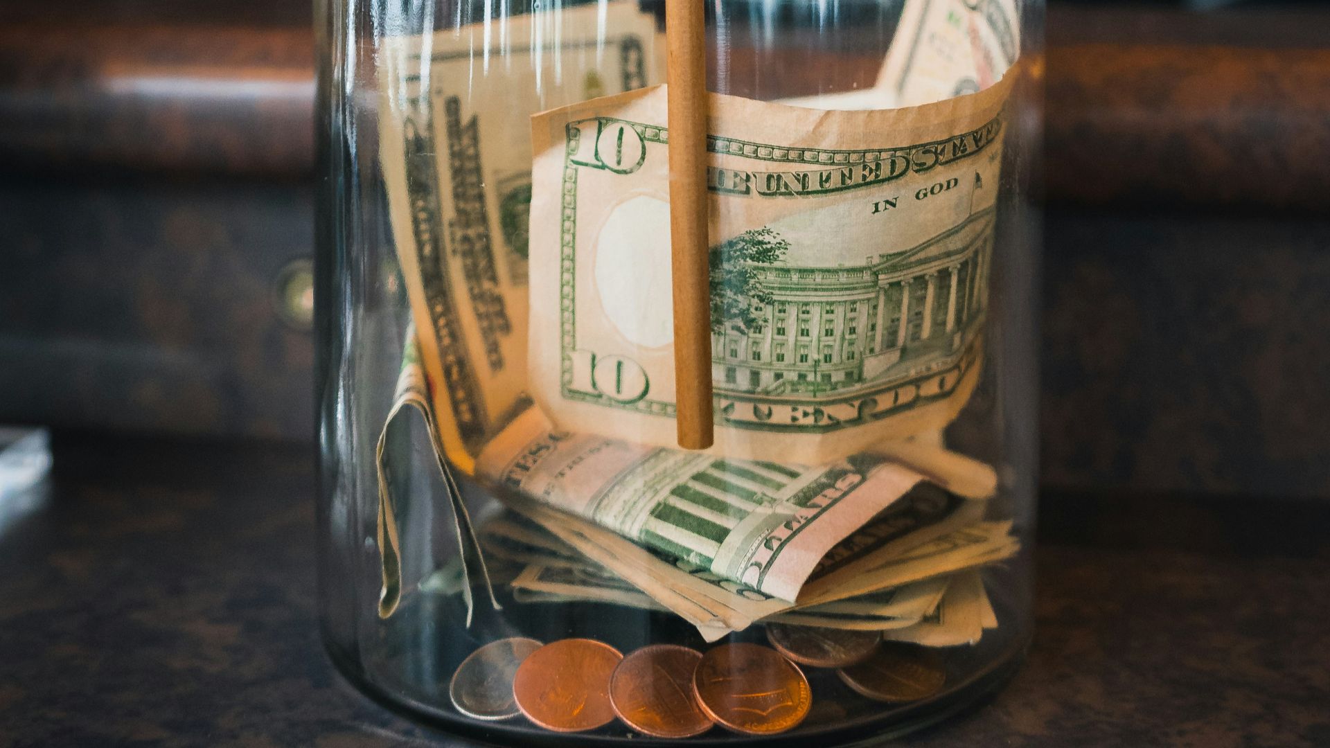 clear glass jar on brown wooden table