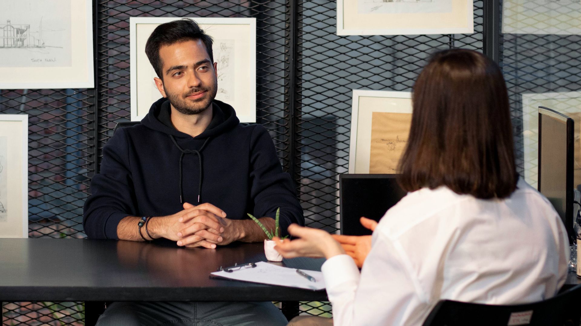 a man and a woman sitting at a table