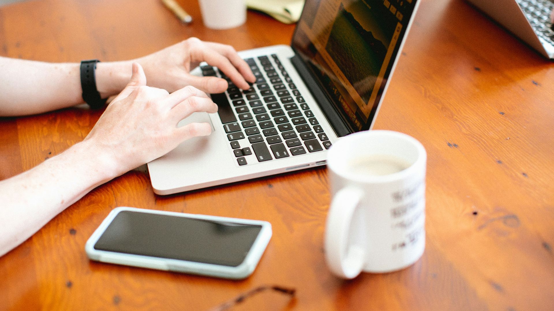 woman using MacBook Pro