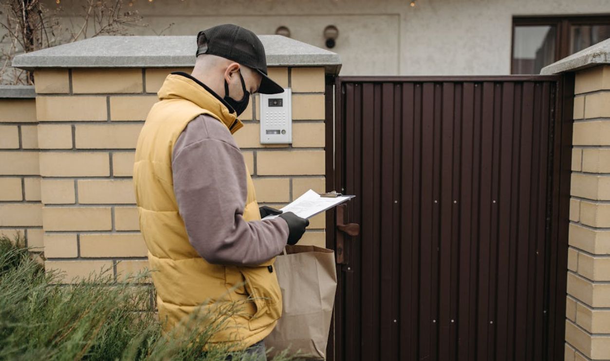 Holding Lease Papers Outside house