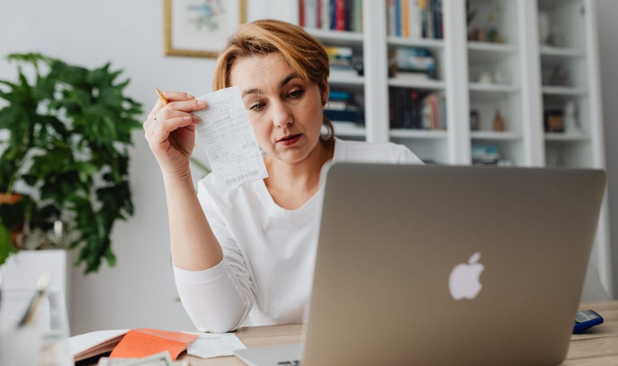 Woman Calculating Her Receipts 