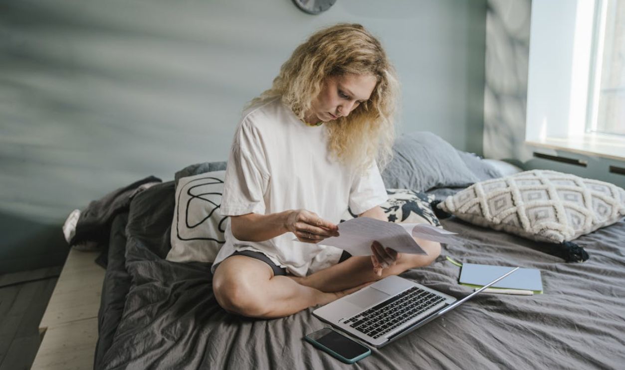 Woman in White Long Sleeve Shirt Using Macbook Air