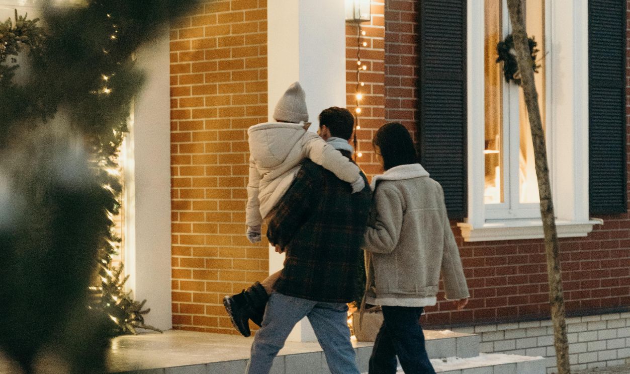 A Family Going Up on the Stairs in their House