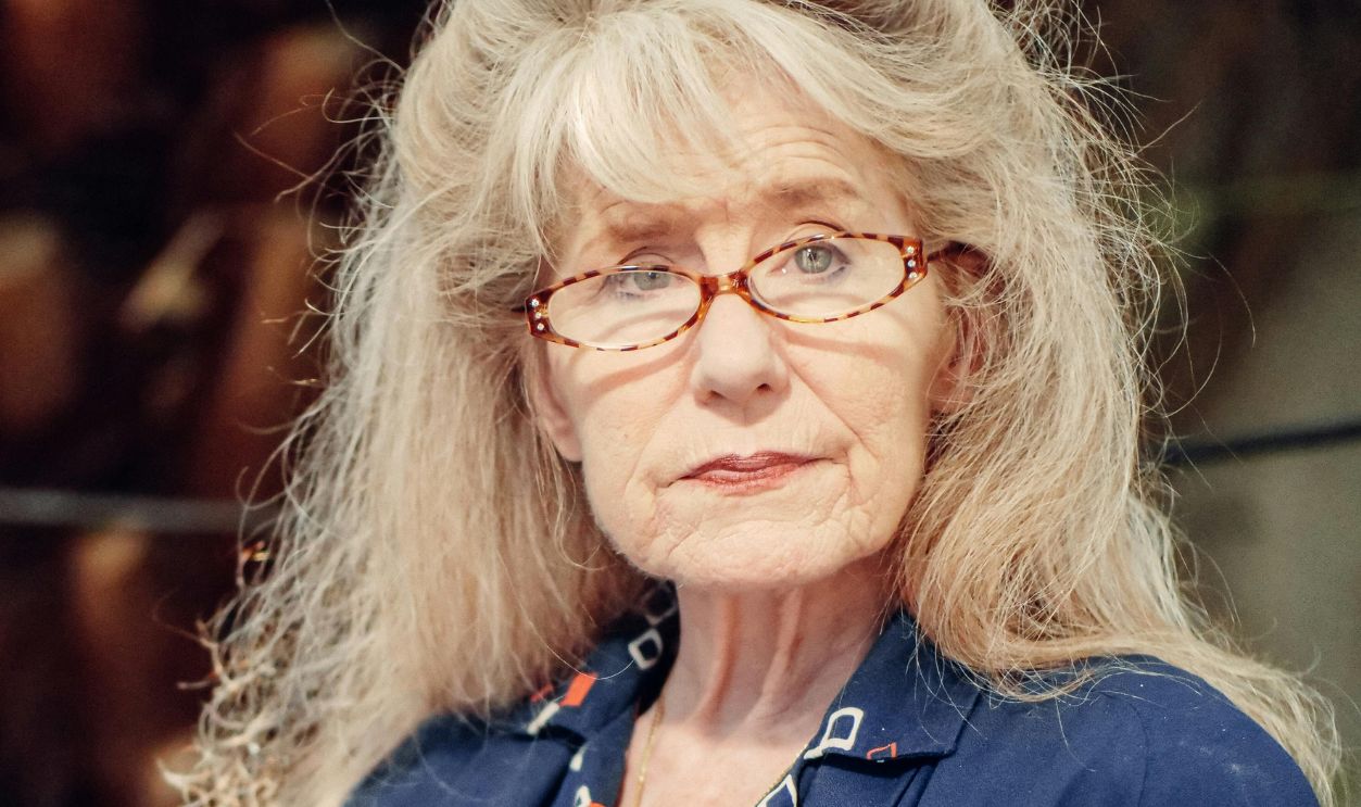 An Elderly Woman in Blue Blazer Wearing Eyeglasses