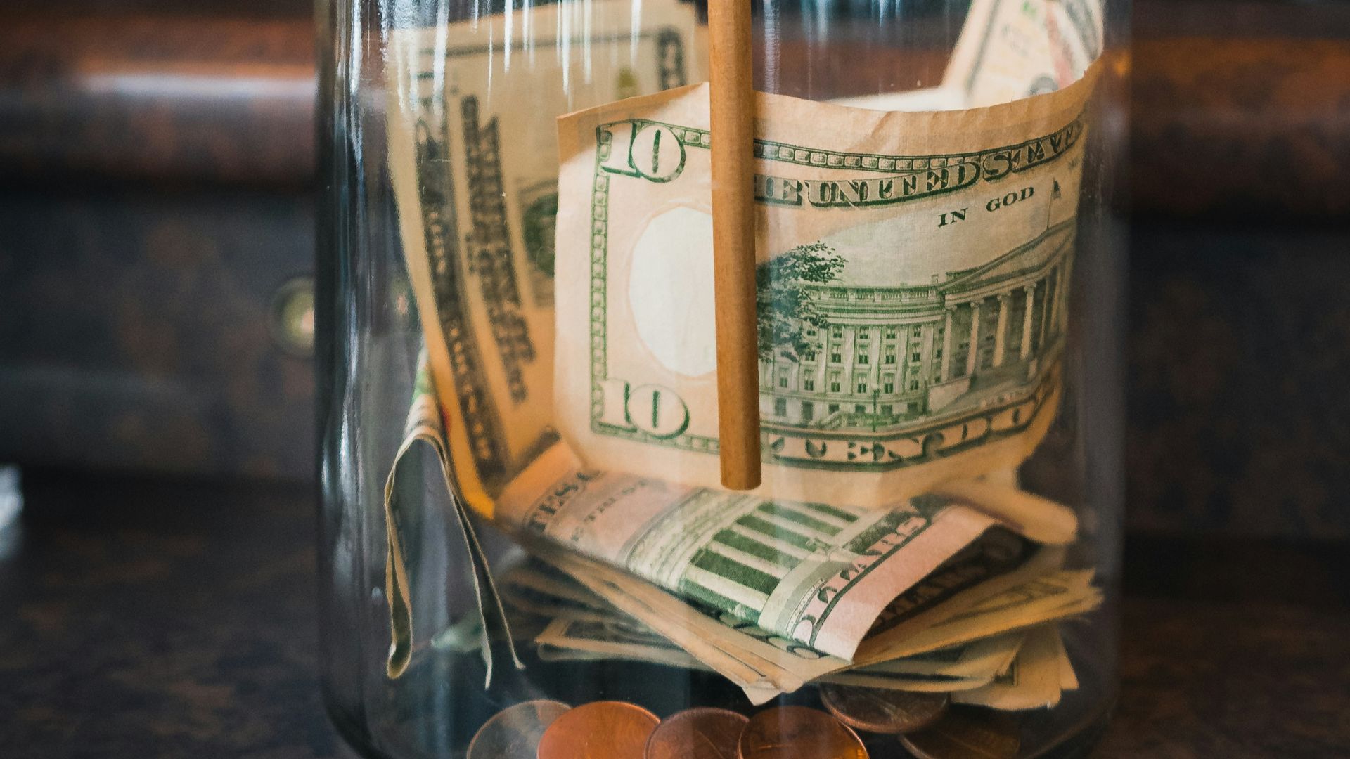 clear glass jar on brown wooden table