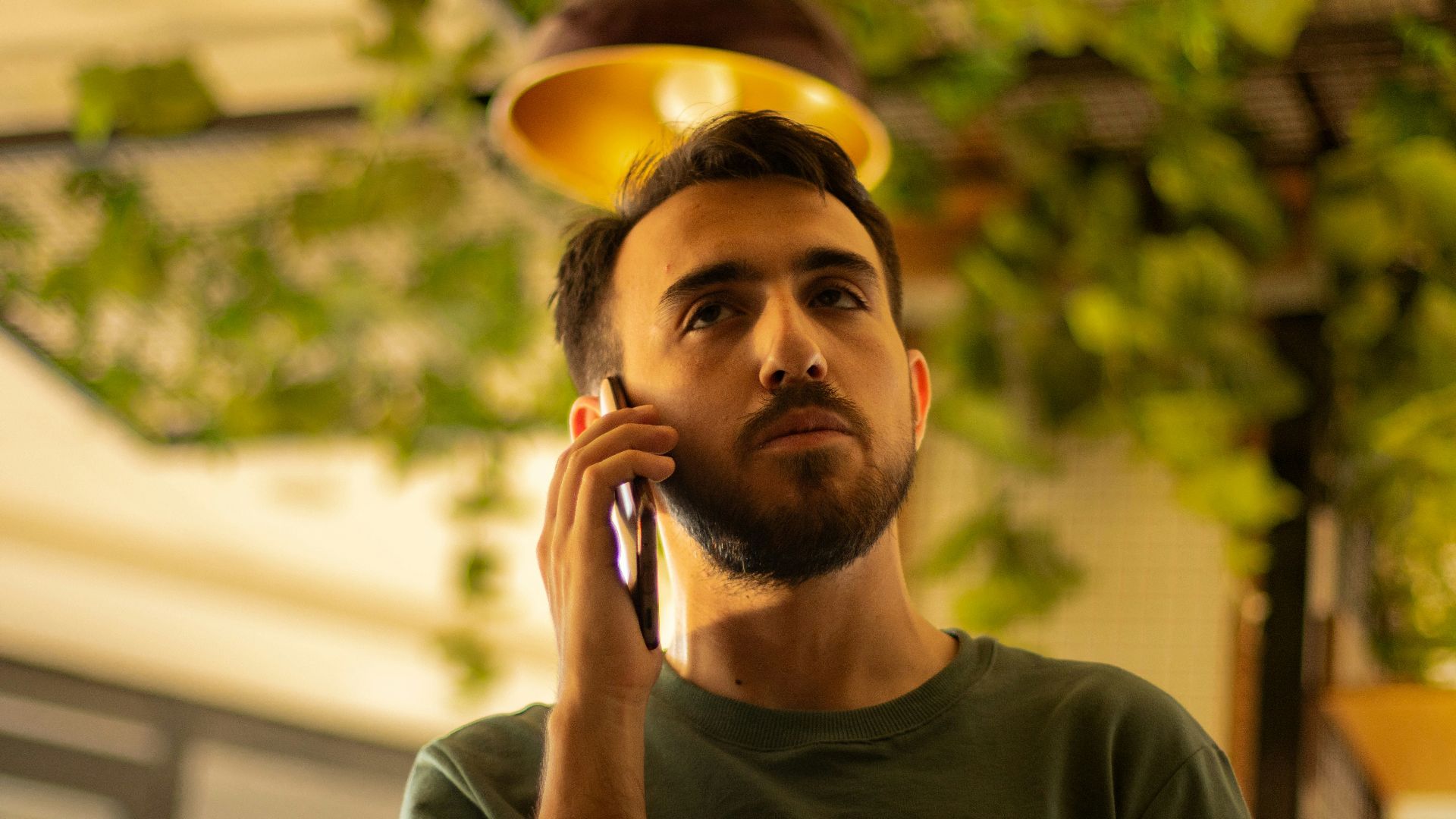 A man is talking on his cell phone