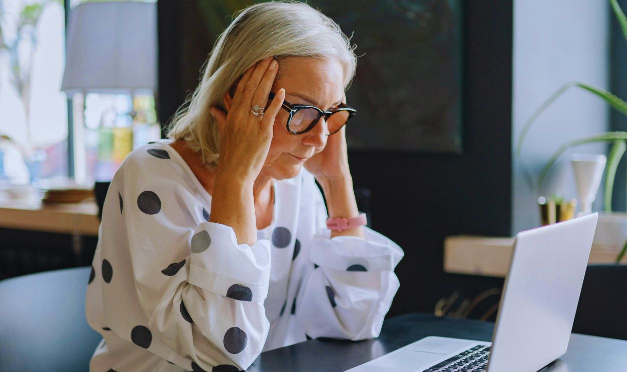 Stressed Woman Using a Laptop