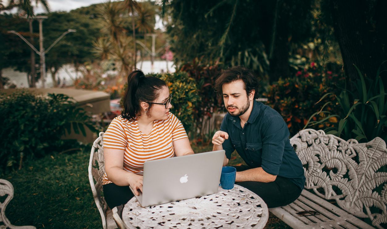 Outdoor Collaboration with Laptop in Garden