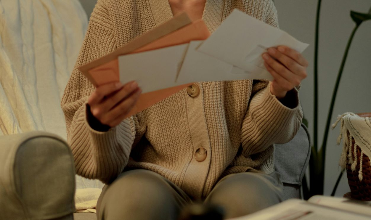 Woman sitting and checking letters