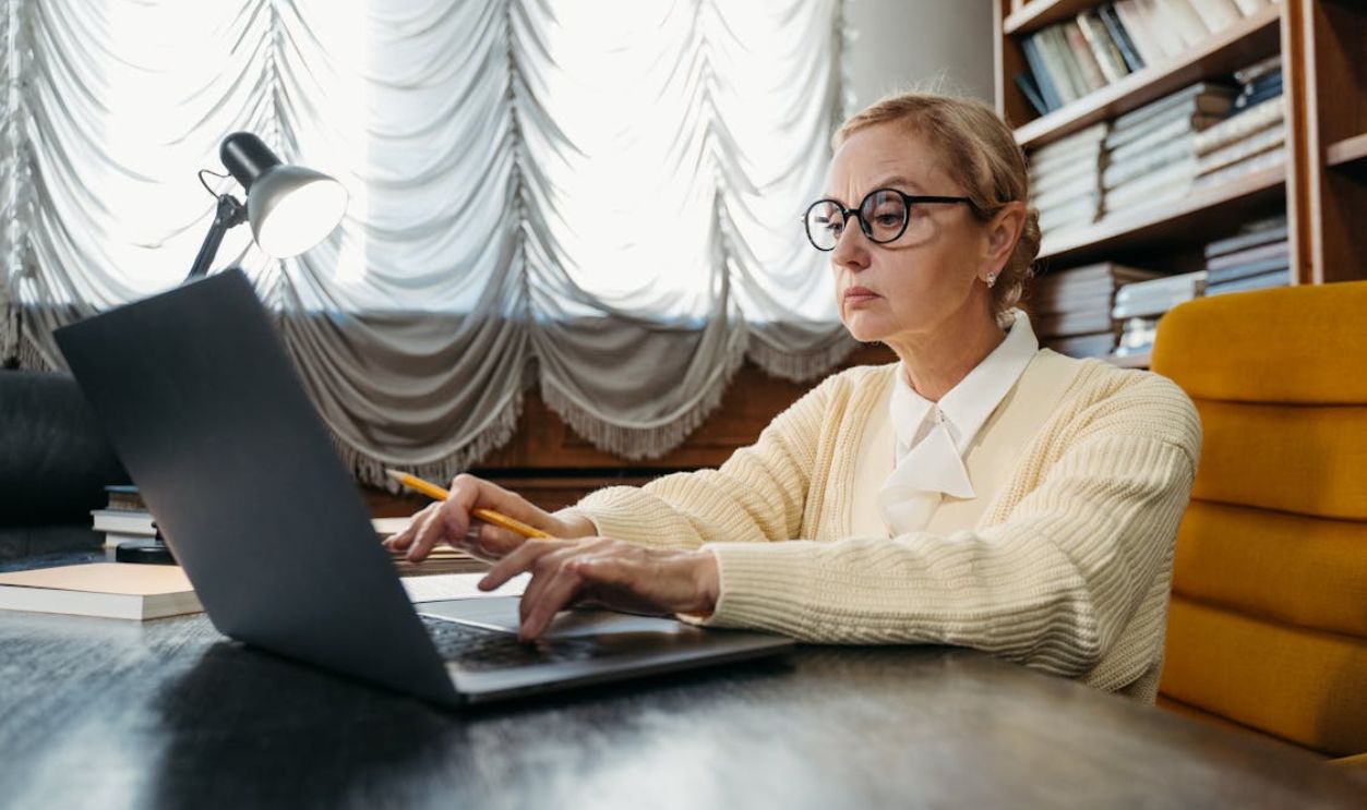 A Woman Sitting at the Table