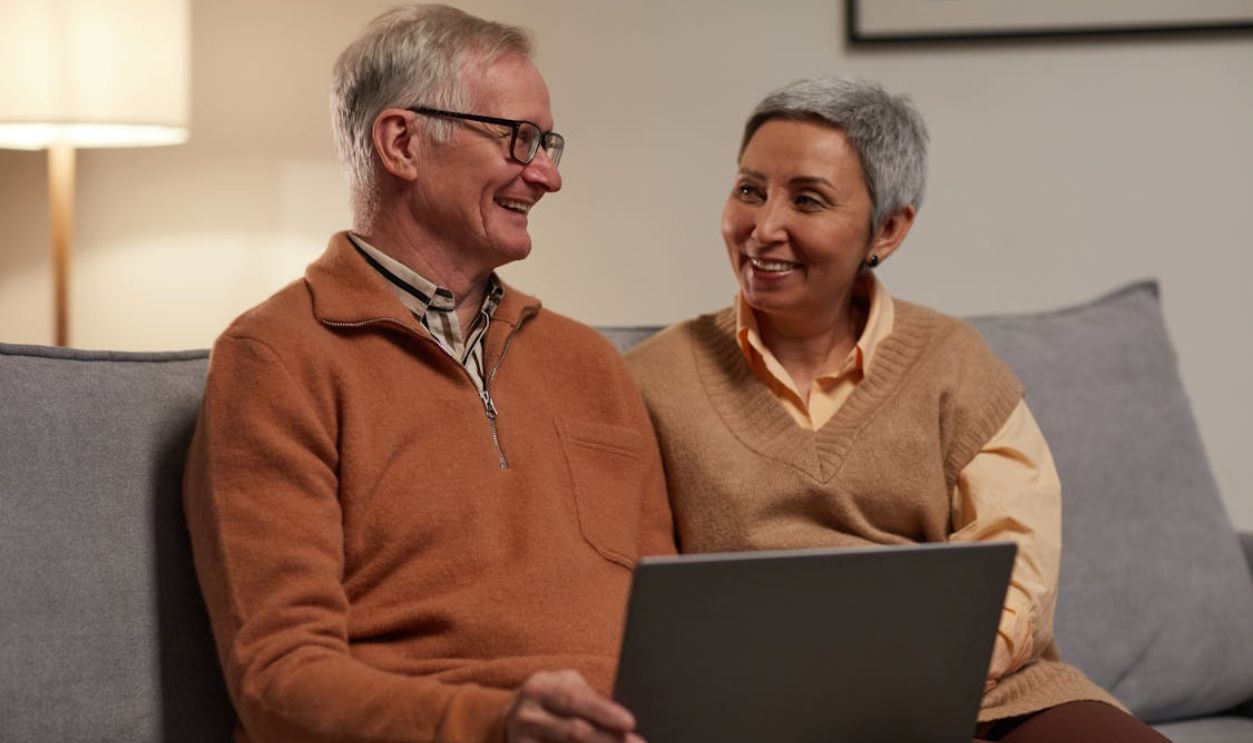 Man and Woman Sitting on Sofa
