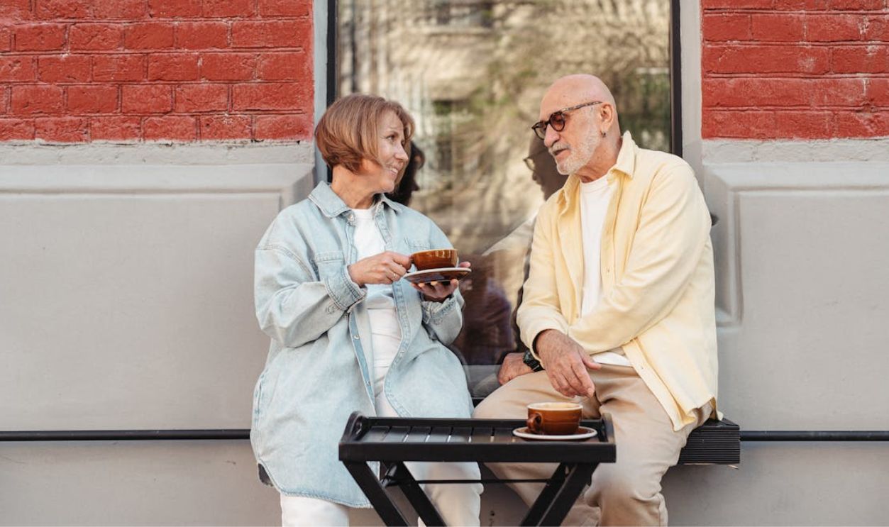 Man and Woman Sitting on Bench