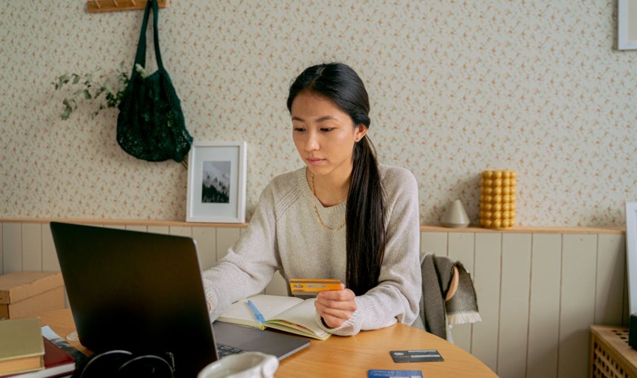 Woman in Gray Sweater Online Shopping