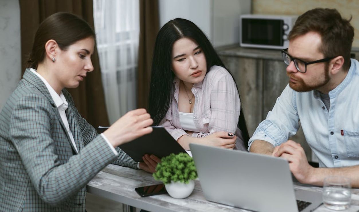 Group of People Discussing Notes Together