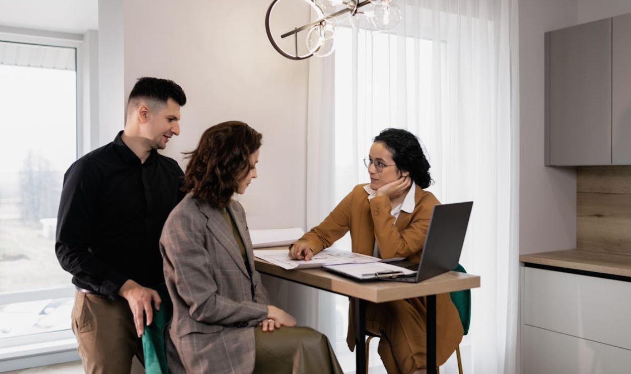 A Woman Having a Discussion with a Couple