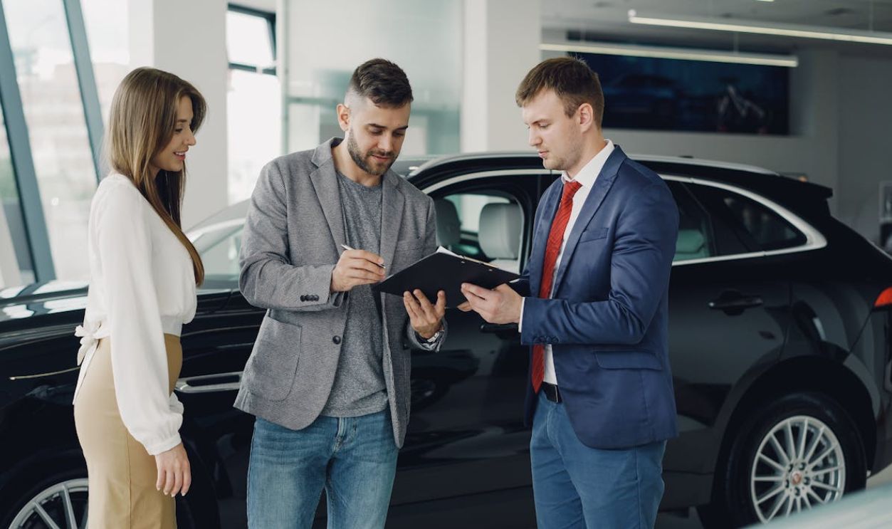 Car Dealership Meeting with Customers Indoors