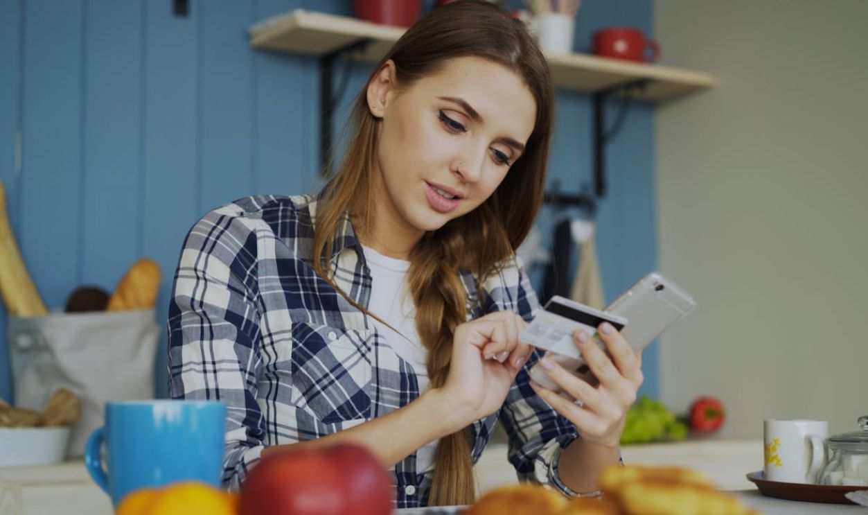Young Woman Shopping Online at Home