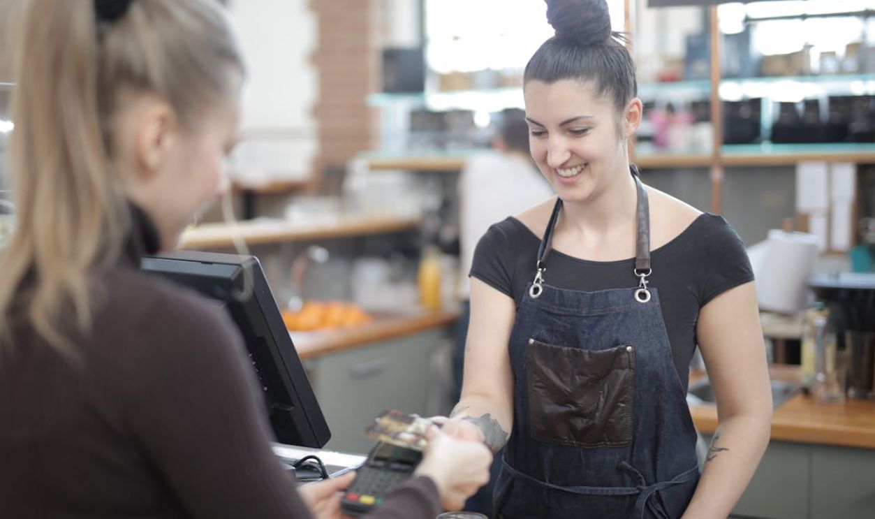 Woman Paying with Credit Card