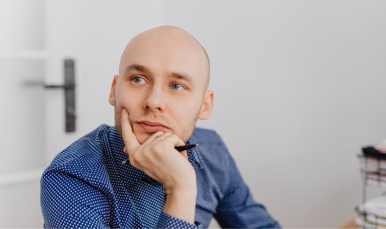 A Man Leaning on His Hand