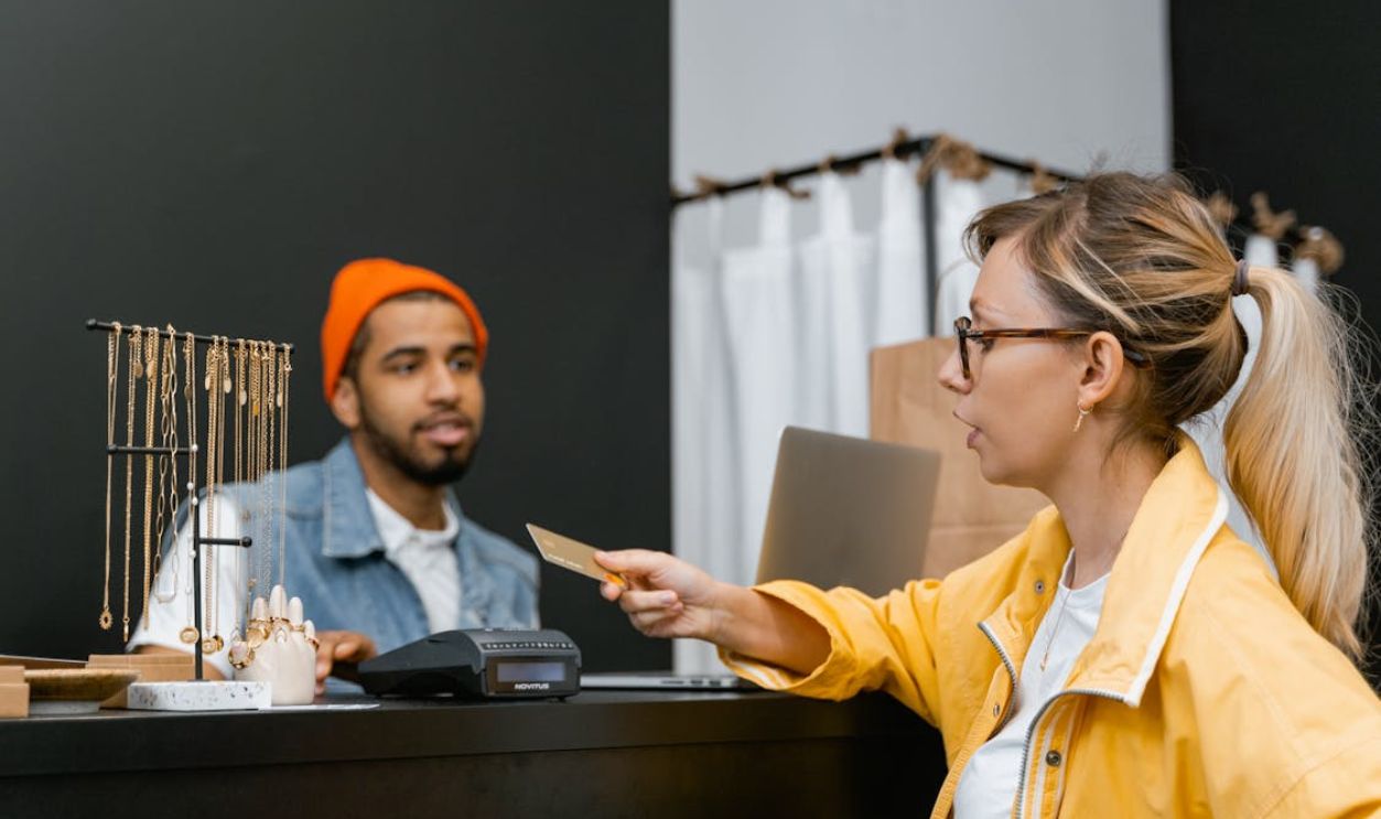 A Woman Using a Credit Card in a Store