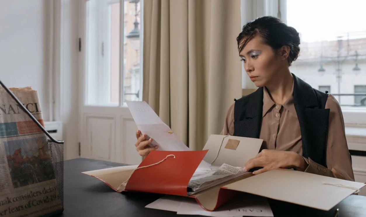 A Woman Holding Documents