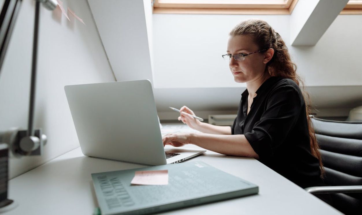 Close-up Photo of Female Architect using Laptop