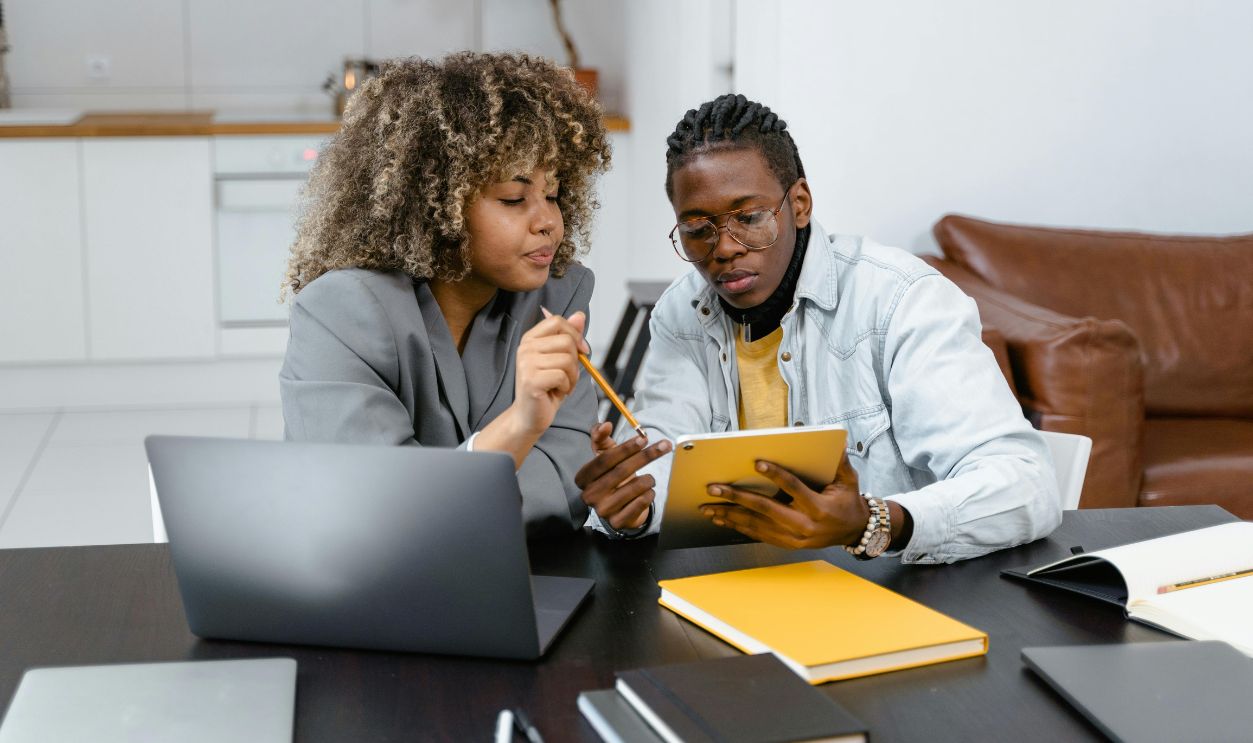 A Man and Woman Planning while Looking at the Tablet