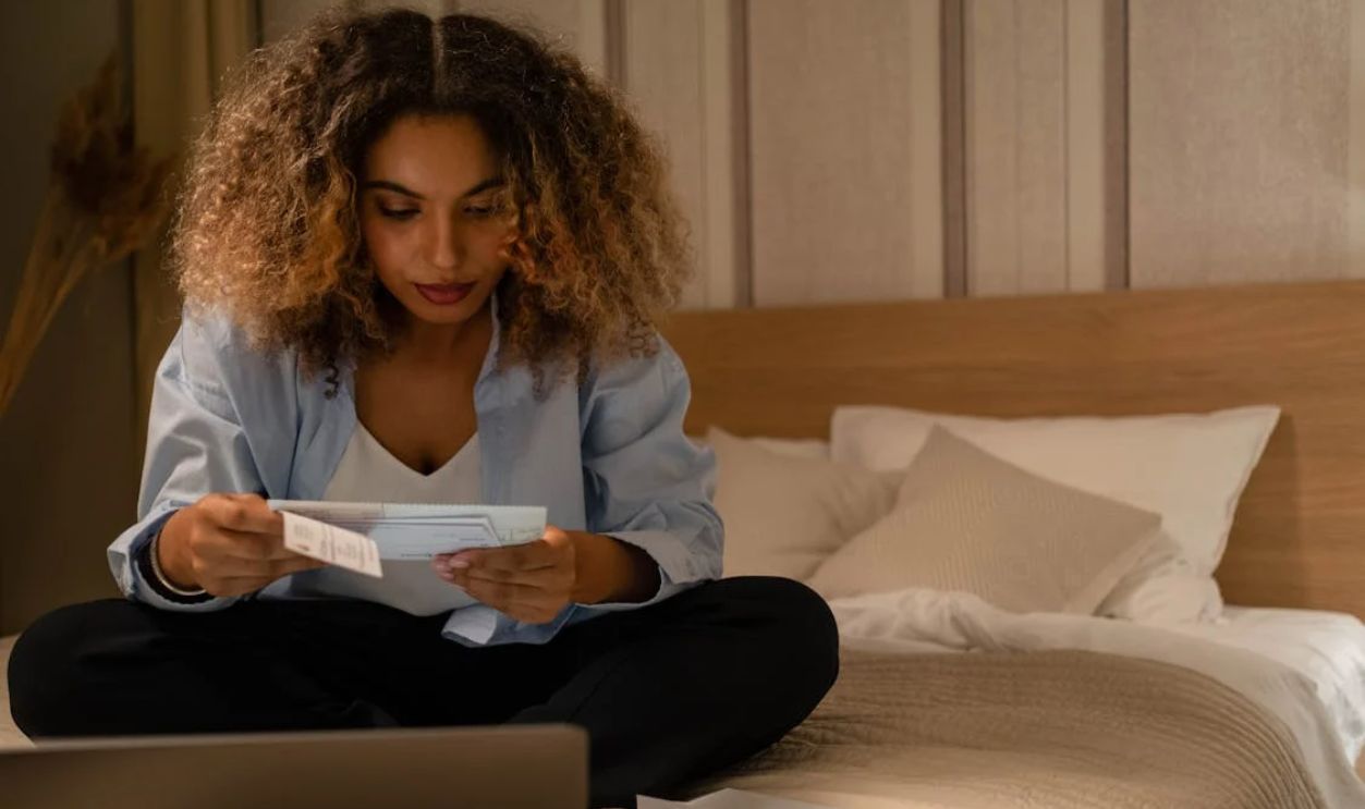 Photo of a Woman Reading a Letter